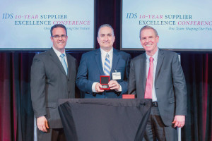 David Pearson, President of LCR, at center accepting award from John Bergeron (left) and Mike Shaughnessy (right) of Raytheon